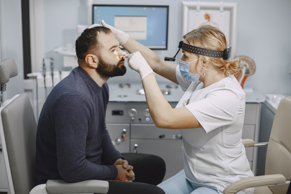 Otolaryngologist preparing for the medical examination procedure